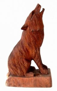 Holzfigur Wolf sitzend - 20 cm